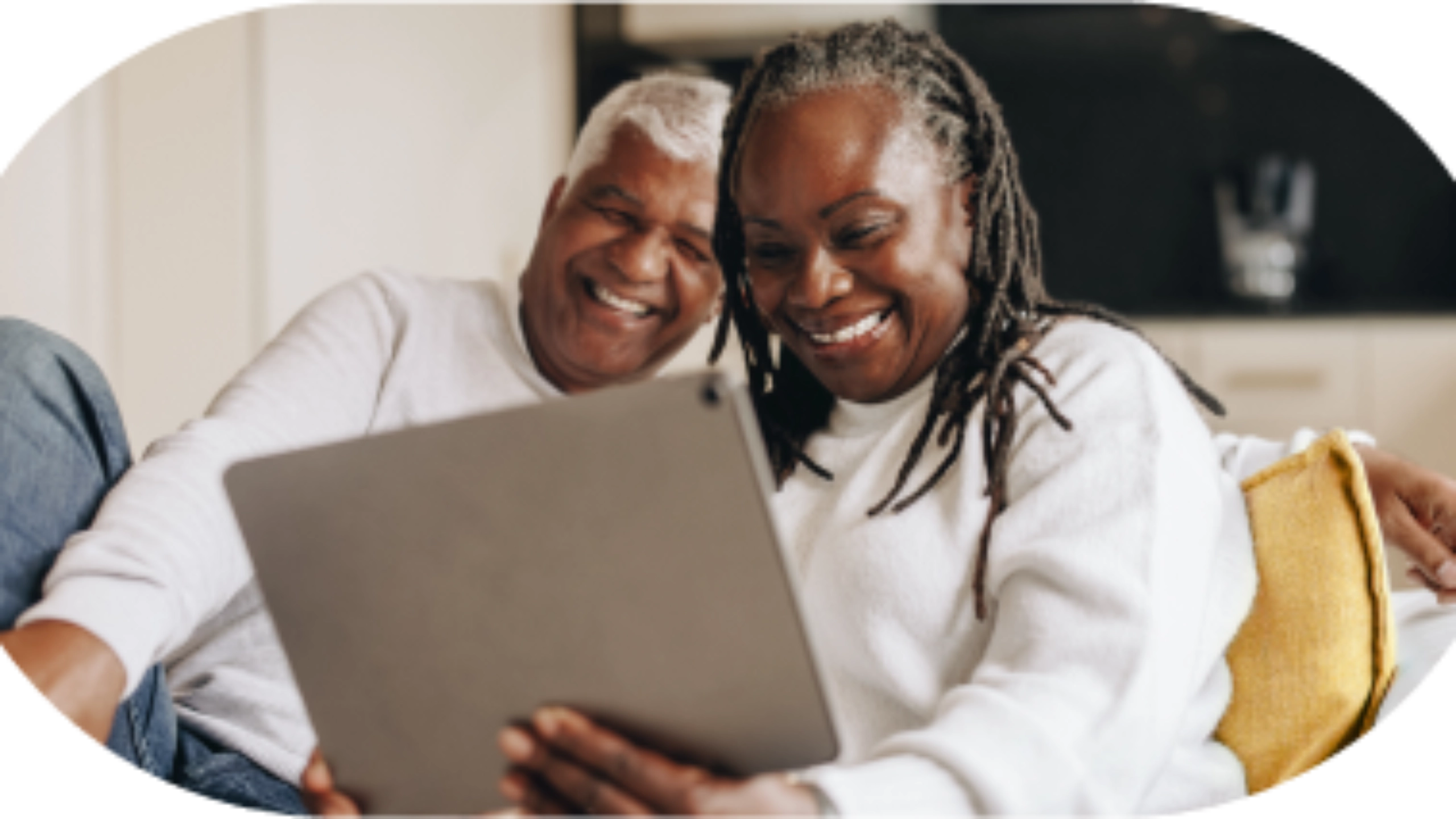 A couple looking at a tablet